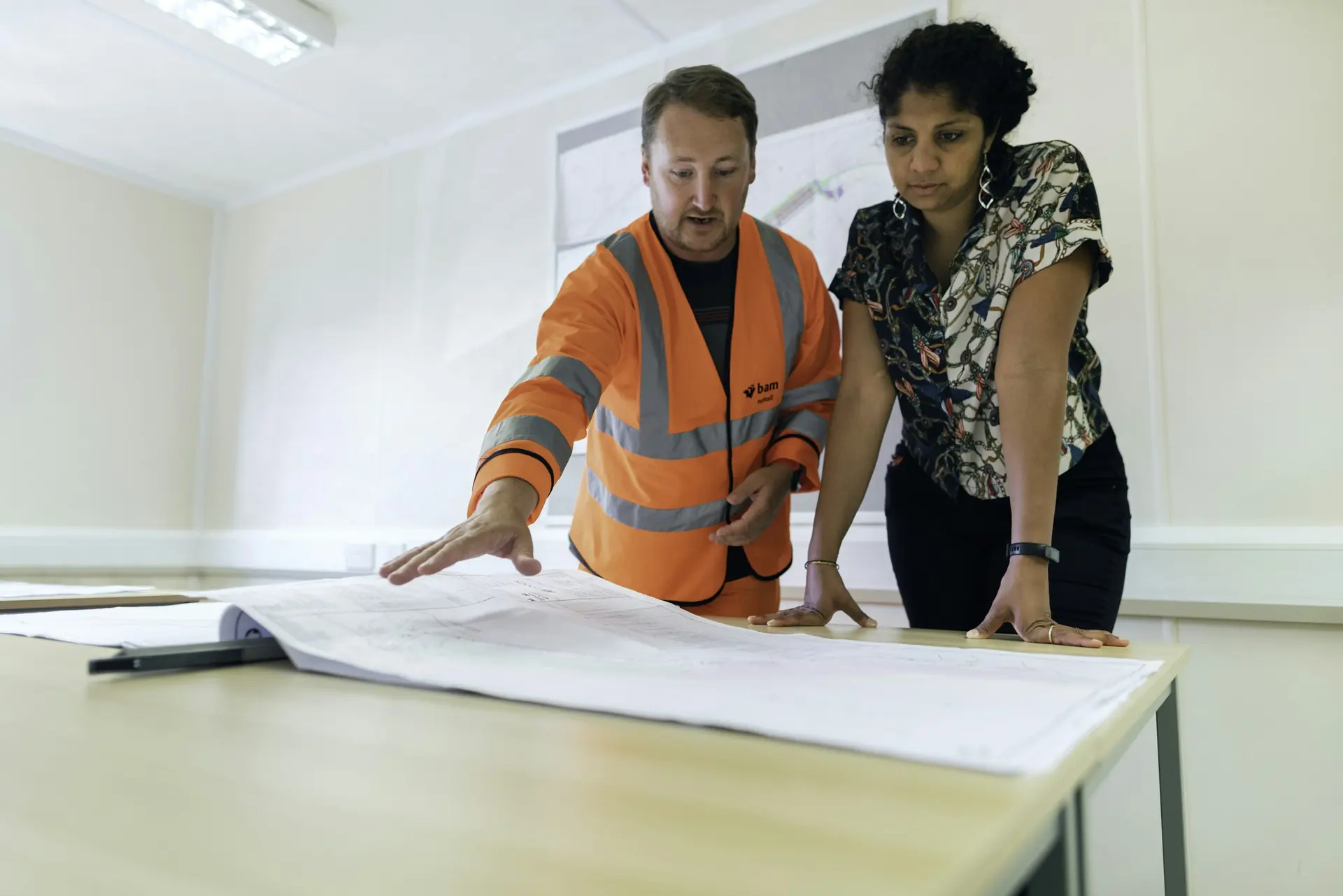 Engineers reviewing drawings