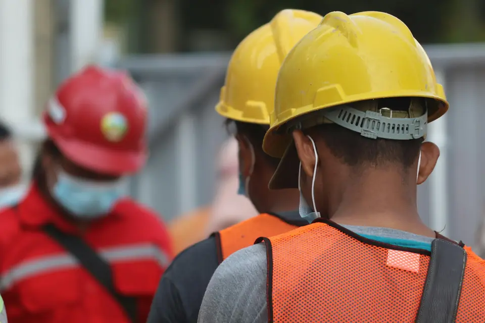Crew in hard hats on site